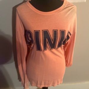 It’s a pink long sleeve t-shirt for women